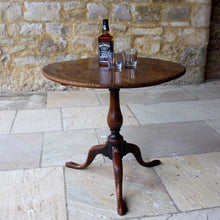 Load image into Gallery viewer, very-nice-george-III-third-mahogany-tilt-top-tripod-table-top-single-plank-mahogany-really-attractive-rim-carved-harlequin-design-repeated-tripod-legs-top-ring-turned-baluster-shape-pedestal-table-wonderful-patina-gold-red-colours-contrasting-darker-brown-black-appearance-created-really-good-decorative-highly-functional-tilt-top-table-damon-blandford-antiques-cotswolds-gloucestershire-stroud-for-sale-interior-design-jack-daniels-drink-glasses