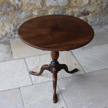 Load image into Gallery viewer, very-nice-george-III-third-mahogany-tilt-top-tripod-table-top-single-plank-mahogany-really-attractive-rim-carved-harlequin-design-repeated-tripod-legs-top-ring-turned-baluster-shape-pedestal-table-wonderful-patina-gold-red-colours-contrasting-darker-brown-black-appearance-created-really-good-decorative-highly-functional-tilt-top-table-damon-blandford-antiques-cotswolds-gloucestershire-stroud-for-sale-interior-design