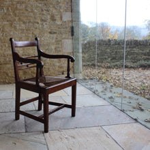 Load image into Gallery viewer, seat-chair-armchair-well-provincial-elm-chair-rush-seat-excellent-condition-good-colour-constructed-scrolled-chamfered-cross-rails-ball-decoration-well-figured-top-rail-scrolled-arm-rests-ring-turned-raised-square-tapered-legs-stretcher-elegant-design-wide-rush-seat-sloping-back-chair-comfortable-east-anglia-english-circa-1820-damon-blandford-antiques-gloucestershire-stroud-cotswolds-for-sale