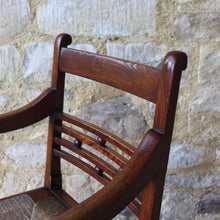 Load image into Gallery viewer, seat-chair-armchair-well-provincial-elm-chair-rush-seat-excellent-condition-good-colour-constructed-scrolled-chamfered-cross-rails-ball-decoration-well-figured-top-rail-scrolled-arm-rests-ring-turned-raised-square-tapered-legs-stretcher-elegant-design-wide-rush-seat-sloping-back-chair-comfortable-east-anglia-english-circa-1820-damon-blandford-antiques-gloucestershire-stroud-cotswolds-for-sale