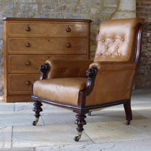Load image into Gallery viewer, super-shape-leather-library-chair-third-quarter-19th-century-gently-reclining-scrolled-backrest-mahogany show-wood-frame-carved-lion-head-details-contrasting-beautifully-light-brown-tobacco-colour-leather-upholstery-sprung-seat-backrest-raised-well-proportioned-square-swept-legs-rear-turned-carved-legs-front-original-brass-cup-castors-porcelain-wheels-chair-real-presence-grandeur-damon-blandford-antiques-seating-upholstery-gloucestershire-cotswolds-interior-style-decoration-decorative-country-house-for-sale