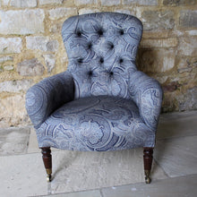 Load image into Gallery viewer, victorian-deep-button-back-upholstered-armchair-beautiful-shape-turned-legs-front-square-legs-rear-original-brass-castors-chair-professionally-re-upholstered-stunning-ludhiana-wool-fabric-intricate-decoration-inspiration-traditional-indian-patterns-swirling-floral-design-blue-cream-colourway-stylish-chair-elegant-design-english-late-victorian-damon-blandford-antiques-for-sale-the-malthouse-collective-stroud-gloucestershire-cotswolds-for-sale-antique-seating