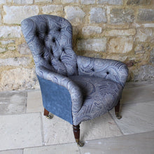 Load image into Gallery viewer, victorian-deep-button-back-upholstered-armchair-beautiful-shape-turned-legs-front-square-legs-rear-original-brass-castors-chair-professionally-re-upholstered-stunning-ludhiana-wool-fabric-intricate-decoration-inspiration-traditional-indian-patterns-swirling-floral-design-blue-cream-colourway-stylish-chair-elegant-design-english-late-victorian-damon-blandford-antiques-for-sale-the-malthouse-collective-stroud-gloucestershire-cotswolds-for-sale-antique-seating