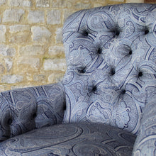 Load image into Gallery viewer, victorian-deep-button-back-upholstered-armchair-beautiful-shape-turned-legs-front-square-legs-rear-original-brass-castors-chair-professionally-re-upholstered-stunning-ludhiana-wool-fabric-intricate-decoration-inspiration-traditional-indian-patterns-swirling-floral-design-blue-cream-colourway-stylish-chair-elegant-design-english-late-victorian-damon-blandford-antiques-for-sale-the-malthouse-collective-stroud-gloucestershire-cotswolds-for-sale-antique-seating
