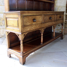 Load image into Gallery viewer, welsh-dresser-and-&-rack-fabulous-original-sun-bleached-colour-rack-moulded-cornice-above-frieze-blacksmith-forged-iron-cup-hooks-over-three-shelves-base-three-drawers-equal-length-original-turned-wooden-drawer-pulls-inlaid-mother-pearl-decoration-ring-turned-supports-carved-spandrels-pot-board-raised-bracket-feet-dresser-originates-mid-wales-newtown-powys-circa-1810-incredibly-attractive-damon-blandford-antiques-for-sale-stroud-gloucestershire