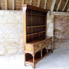 Load image into Gallery viewer, welsh-dresser-and-&-rack-fabulous-original-sun-bleached-colour-rack-moulded-cornice-above-frieze-blacksmith-forged-iron-cup-hooks-over-three-shelves-base-three-drawers-equal-length-original-turned-wooden-drawer-pulls-inlaid-mother-pearl-decoration-ring-turned-supports-carved-spandrels-pot-board-raised-bracket-feet-dresser-originates-mid-wales-newtown-powys-circa-1810-incredibly-attractive-damon-blandford-antiques-for-sale-stroud-gloucestershire
