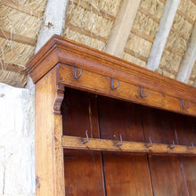 Load image into Gallery viewer, welsh-dresser-and-&-rack-fabulous-original-sun-bleached-colour-rack-moulded-cornice-above-frieze-blacksmith-forged-iron-cup-hooks-over-three-shelves-base-three-drawers-equal-length-original-turned-wooden-drawer-pulls-inlaid-mother-pearl-decoration-ring-turned-supports-carved-spandrels-pot-board-raised-bracket-feet-dresser-originates-mid-wales-newtown-powys-circa-1810-incredibly-attractive-damon-blandford-antiques-for-sale-stroud-gloucestershire