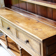 Load image into Gallery viewer, welsh-dresser-and-&-rack-fabulous-original-sun-bleached-colour-rack-moulded-cornice-above-frieze-blacksmith-forged-iron-cup-hooks-over-three-shelves-base-three-drawers-equal-length-original-turned-wooden-drawer-pulls-inlaid-mother-pearl-decoration-ring-turned-supports-carved-spandrels-pot-board-raised-bracket-feet-dresser-originates-mid-wales-newtown-powys-circa-1810-incredibly-attractive-damon-blandford-antiques-for-sale-stroud-gloucestershire