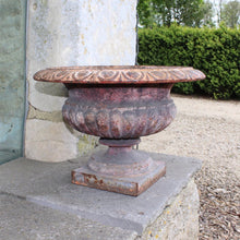 Load image into Gallery viewer, heavy-cast-iron-tazza-shaped-urn-fine-quality-fluted-body-heavy-square-pedestal-base-egg-dart-decoration-rim-wider-form-classical-shaped-urn-planter-beautifully-time-worn-finish-remnants-old-grey-red-paint-faded-pink-attractive-equally-well-suited-use-indoors-out-excellent-condition-english-circa-1860-damon-blandford-antiques-garden-decorative-home-for-sale-stroud-gloucestershire