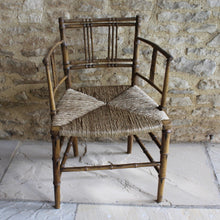 Load image into Gallery viewer, elegant-rush-seated-faux-bamboo-armchair-original-paint-backrest-constructed-two-top-bottom-rails-supporting-grouped-spindles-slender-proportions-arms-newly-woven-rush-seat-turned-legs-stretchers-painted-decoration-emulate-bamboo-retains-excellent-colour-enhanced-by-passage-time-use-aesthetically-beautiful-chair-incredibly-good-solid-example-condition-english-circa-1820-damon-blandford-antiques-for-sale-stroud-gloucestershire-cotswolds-interior-design-decoration