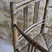 Load image into Gallery viewer, elegant-rush-seated-faux-bamboo-armchair-original-paint-backrest-constructed-two-top-bottom-rails-supporting-grouped-spindles-slender-proportions-arms-newly-woven-rush-seat-turned-legs-stretchers-painted-decoration-emulate-bamboo-retains-excellent-colour-enhanced-by-passage-time-use-aesthetically-beautiful-chair-incredibly-good-solid-example-condition-english-circa-1820-damon-blandford-antiques-for-sale-stroud-gloucestershire-cotswolds-interior-design-decoration