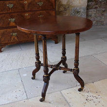 Load image into Gallery viewer, period-aesthetic-movement-side-table-excellent-quality-circular-hardwood-top-four-tapering-ring-turned-fluted-parcel-gilt-legs-cross-stretcher-out-swept-feet-terminating-in-brass-ceramic-castors-applied-carved-gilt-decorative-applique-really-attractive-useful-occasional-table-sofa-side-table-drinks-table-lamp-table-for-sale-damon-blandford-antiques-stroud-gloucestershire