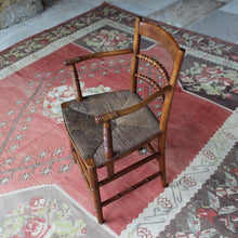Load image into Gallery viewer, early-19th-century-rush-seated-open-armchair-excellent-quality-combining-carved-turned-details-shaped-bobbin-carved-mid-rails-shaped-top-rail-circular-styles-wonderfully-shaped-arm-rests-ring-turned-arm-supports-rush-seat-very-comfortable-chair-faux-bamboo-legs-stretchers-excellent-quality-condition-english-circa-1850s-for-sale-damon-blandford-antiques-stow-on-the-wold-stroud-cotswolds-gloucestershire-oxfordshire-interior-decor