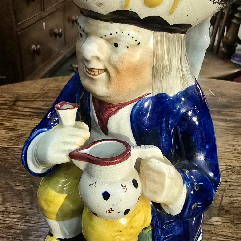 Yorkshire-prattware-pottery-Toby -jug-character-holding-pitcher-cup-cobalt-blue-coat-yellow-ochre-breeches-metallic-oxides-regional-kilns-caryatid-handle-spongeware-decoration-plinth-base-tricorn-hat-excellent-condition-Mexborough-for-sale-damon-blandford-antiques-stow-on-the-wold-cotswolds