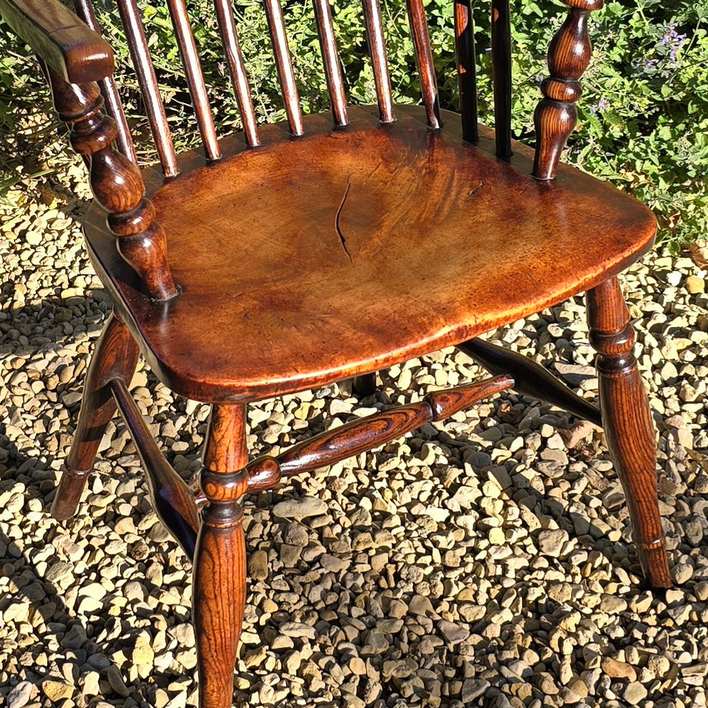 Lovely-colour-19th-century-windsor-arm-chair-low-hoop-stick-back-arm-rests-nicely-turned-supports-rare-alder-wood-saddled-seat-raised-on-turned-legs-h-shape-stretchers-design-north-east-or-thames-valley-areas-alder-shaped-comfortable-chair-excellent-condition-contemporary-period-settings-seating-for-sale-damon-blandford-antiques-stow-on-the-wold-cotswold-antiques