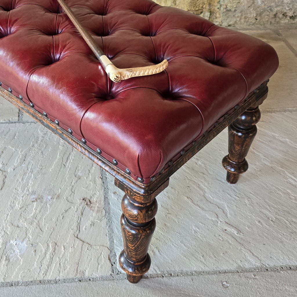 Striking-19th-century-stool-good-size-proportions-upholstered-deep-buttoned-oxblood-red-leather-turned-faux-bois-legs-simulated-rosewood-black-golden-brown-colours-eye-catching-furniture-function-well-living-room-bed-room-hall-riding-crop-whip-bdsm-for-sale-damon-blandford-antiques-stroud-cotswolds