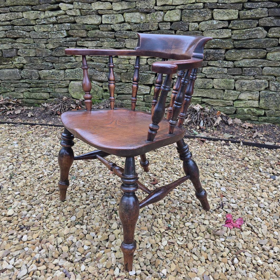 Well-proportioned-19th-century-ash-elm-captains-smokers-bowback-armchair-features-wide-bow-back-deep-scrolled-crest-rail-ring-turned-spindles-well-figured-saddle-seat-bulbous-baluster-shape-legs-H-shape-stretcher-DC-good-solid-comfortable-chair-excellent-condition-for-sale-damon-blandford-antiquesd-stow-on-the-wold-cotswolds