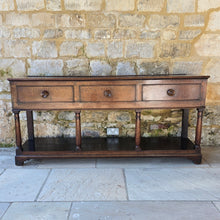 Load image into Gallery viewer, good-early-19th-century-welsh-oak-dresser-base-three-drawers-cock-beading-original-turned-wooden-drawer-pulls-apron-applied-moulded-edge-turned-supports-pot-board-bracket-feet-good-colour-excellent-condition-for-sale-damon-blandford-antiques-stow-on-the-wold-cotswolds
