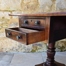 Load image into Gallery viewer, excellent-quality-table-features-cuban-mahogany-top-two-drop-leaves-two-faux-two-working-drawers-fitted-writing-slope-cock-beading-decorative-brass-knob-drawers-pulls-reeded-baluster-shape-pedestal-plinth-base-lion-paw-feet-good-condition-attractive-use-sofa-side-lamp-table-english-circa-1830-for-sale-damon-blandford-antiques-stow-on-the-wold-cotswold
