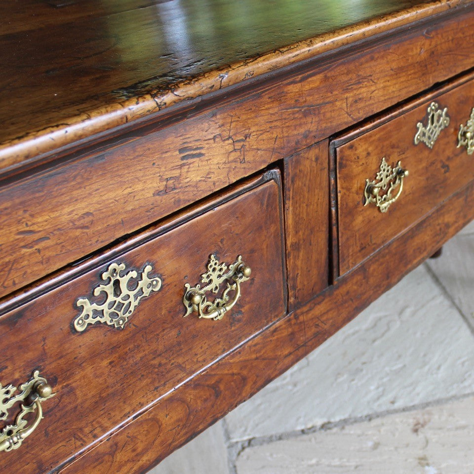 really-good-colour-provincial-cherrywood-serving-console-sofa-table-george-II-III-georgian-two-plank-top-applied-mouldings-three-drawers-rebated-butt-joint-construction-carved-cock-beading-pierced-brass handles-escutcheons-apron-panels-circular-tapered-legs-incredibly-attractive-table-fabulous-patination-good-usable-condition-time-worn-appearance-tremendous-aesthetic-appeal-small-proportions-northern-england-circa-1760-for-sale-damon-blandford-antiques-stow-on-the-wold-cotswolds-decorative-interiors-design