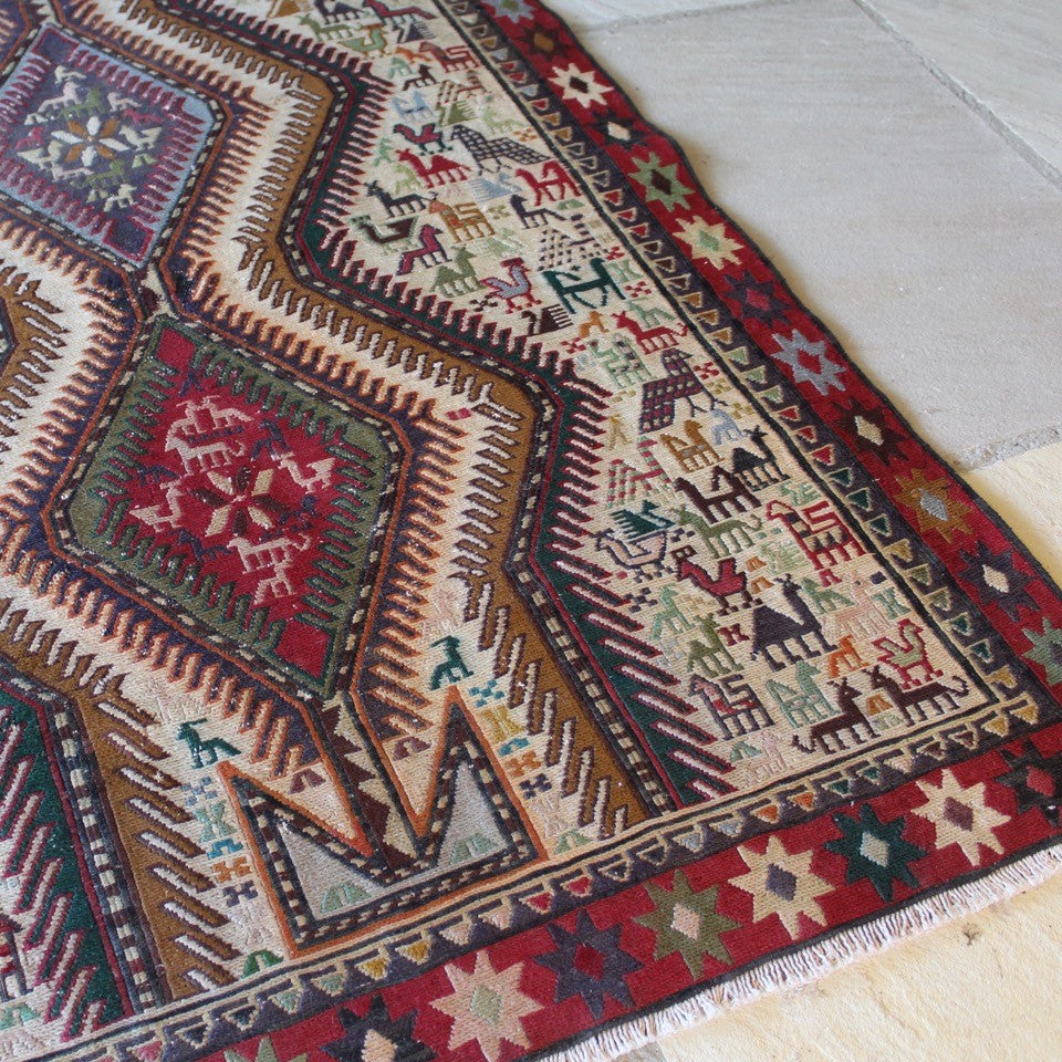 stunning-sumac-runner-featuring-six-adjoined-central-medallions-profusion-of-ark-animal-motifs-main-boarder-star-motifs-red-ground-happiness-fertility-noah's-ark-mount-ararat-eastern-anatolia-Iran.  Sumac-loom-kilims-weaving-technic-anatolia-circa-1950's-for-sale-damon-blandford-antiques-phil-taylors-cool-stuff-stroud-gloucestershire-cotswolds-interior