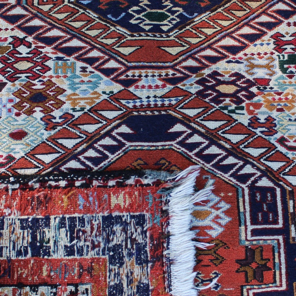 attractive-kilim-rug-hand-woven-loom-shahsevan-nomadic-people-tribe-northwestern-region-iran-design-features-three-large-central-medallions-cream-ground-surrounded-main-border-repeating-star-motifs-symbolising-happiness-fertility-stylised -bird-animal-motifs-predominantly-burnt-orange-cream-blue-colour-1960s-for-sale-damon-blandford-antiques-stroud-cotswolds-carpet-interior-floor