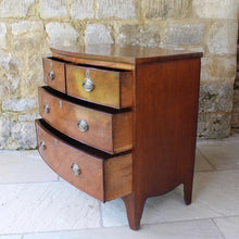 Load image into Gallery viewer, Attractive-early-19th-century-mahogany-bow-fronted-chest-of-drawers-bracket-feet-splayed at-foot-top-cross-banded-satinwood-stringing-two-short-two-long-drawers-cock-beading-drop-handles-drawers-lined-in-mahogany-fine-dovetailing-small-proportions-well-figured-veneer-particular-attractive-for-sale-damon-blandford-antiques-stroud-cotswolds-antique-storage
