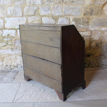 Load image into Gallery viewer, good-quality-18th-century-bureau-constructed-in-oak-fall-front-supported-by-two lopers-bearers-fitted-interior-nine-pigeon-holes-five-small-drawers-concealed-storage-well-two-short-two-long-drawers-dovetail-construction-brass-drop-handles-bracket-feet-highly-original-regional-furniture-excellent-condition-good-colour.-for-sale-damon-blandford-antiques-stow-on-the-wold-cotswolds-antique-strorage
