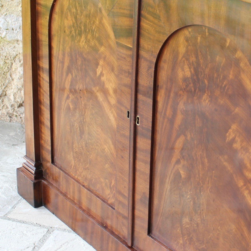 Attractive-victorian-mahogany-chiffonier-well-figured-flame-mahogany-veneers-upper-shelf-turned-mahogany-supports-form-of-classical-columns-frieze-drawers-cupboard-doors-oval-panels-storage-space-height-adjustable-shelves-plinth-base-elegant-highly-functional-design-clean-classical-lines-for-sale-damon-blandford-antiques-stow-on-the-wold-cotswolds-for-sale-damon-blandford-antiques-antique-storage-solutions