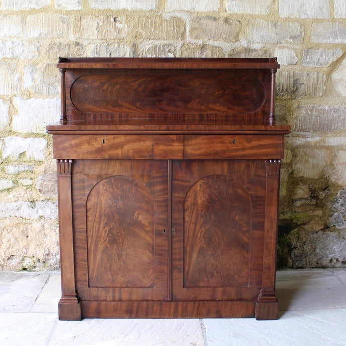 Attractive-victorian-mahogany-chiffonier-well-figured-flame-mahogany-veneers-upper-shelf-turned-mahogany-supports-form-of-classical-columns-frieze-drawers-cupboard-doors-oval-panels-storage-space-height-adjustable-shelves-plinth-base-elegant-highly-functional-design-clean-classical-lines-for-sale-damon-blandford-antiques-stow-on-the-wold-cotswolds-for-sale-damon-blandford-antiques-antique-storage-solutions