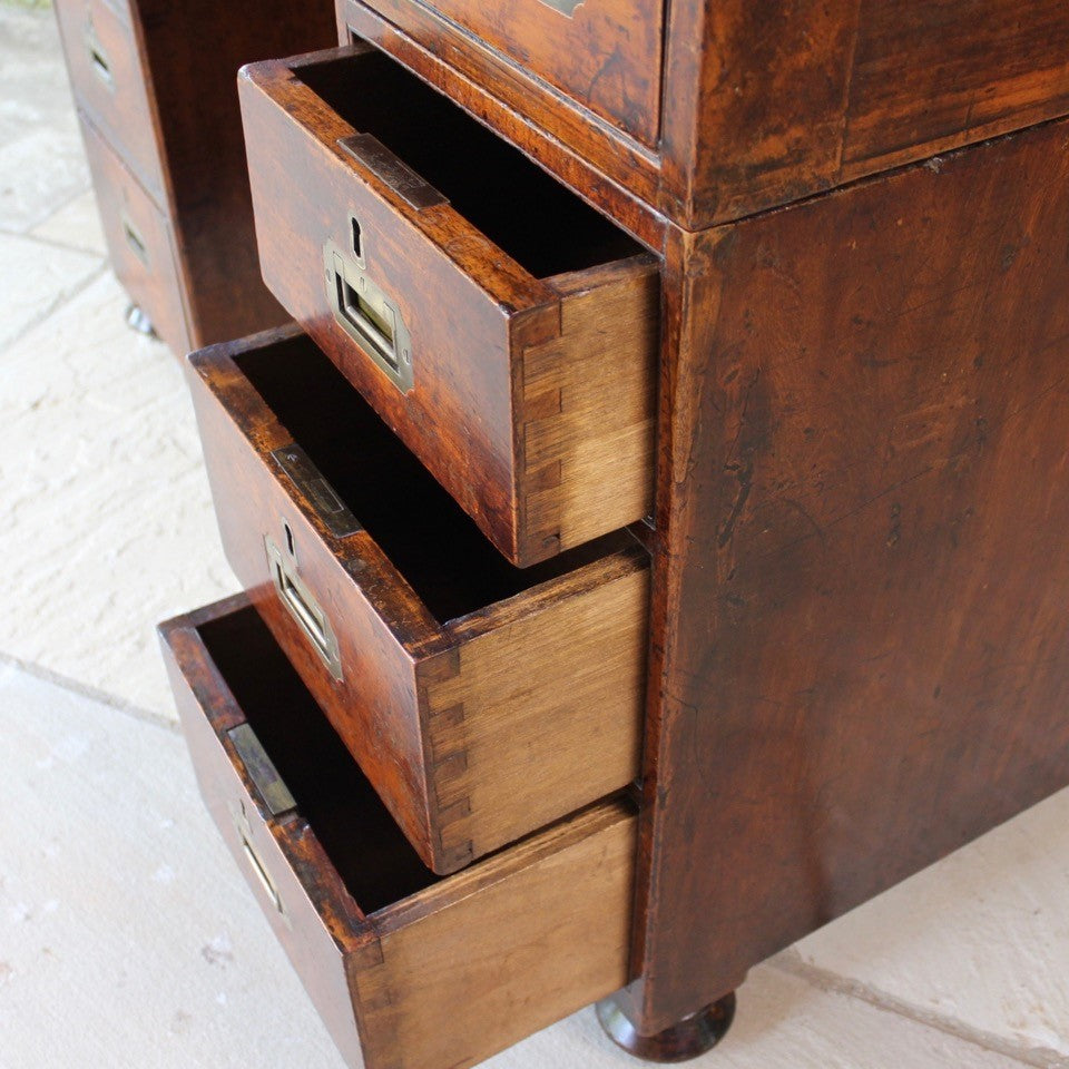 good-19th-century-anglo-chinese-campaign-desk-excellent-colour-hard-wood-teak-compact-heavier-green-leather-skiver-tooled-gilt-decoration-moulded-top-drawers-pedestals-cut-line-mould-fitted-brass-campaign-handles-paneled-back-raised-field-chinese-form-bun-feet-excellent-condition-patina-superb-incredibly-useful-compact-desk-for-sale-damon-blandford-antiques-stow-on-the-wold-cotswolds-home-office-working