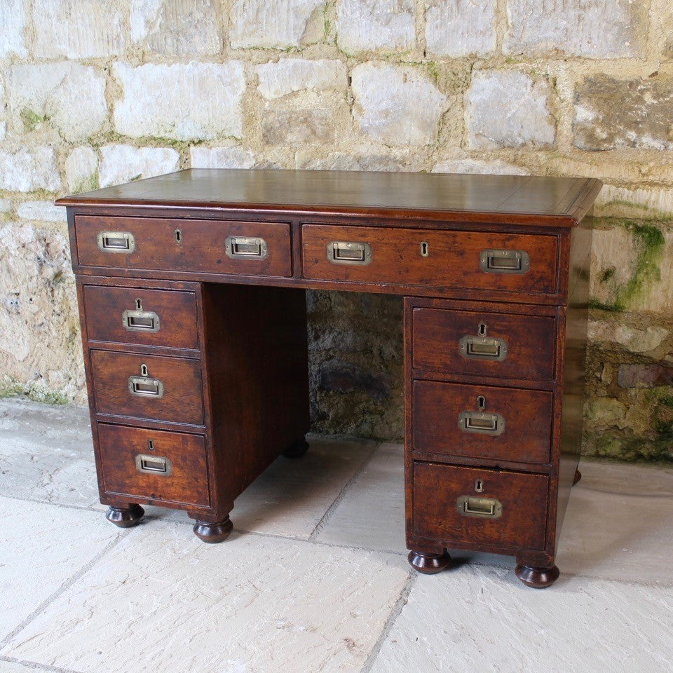 good-19th-century-anglo-chinese-campaign-desk-excellent-colour-hard-wood-teak-compact-heavier-green-leather-skiver-tooled-gilt-decoration-moulded-top-drawers-pedestals-cut-line-mould-fitted-brass-campaign-handles-paneled-back-raised-field-chinese-form-bun-feet-excellent-condition-patina-superb-incredibly-useful-compact-desk-for-sale-damon-blandford-antiques-stow-on-the-wold-cotswolds-home-office-working