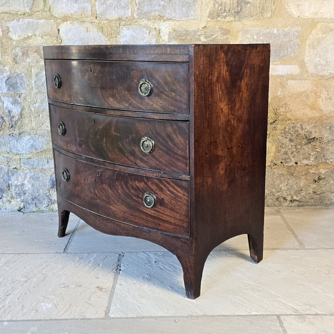 Excellent-example-late-18th-early-19th-century-flame-mahogany-bow-fronted-chest-three-graduated-drawers-wonderful-colour-patination-loved-generation-family-central-london-chelsea-kings-road-fulham-alton-hampshire-war-bonnett-elegant-excellent-condition-for-sale-damon-blandford-antiques-stow-on-the-wold-cotswolds-antique-storage-furniture