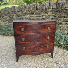 Load image into Gallery viewer, Excellent-example-late-18th-early-19th-century-flame-mahogany-bow-fronted-chest-three-graduated-drawers-wonderful-colour-patination-loved-generation-family-central-london-chelsea-kings-road-fulham-alton-hampshire-war-bonnett-elegant-excellent-condition-for-sale-damon-blandford-antiques-stow-on-the-wold-cotswolds-antique-storage-furniture
