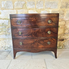 Load image into Gallery viewer, Excellent-example-late-18th-early-19th-century-flame-mahogany-bow-fronted-chest-three-graduated-drawers-wonderful-colour-patination-loved-generation-family-central-london-chelsea-kings-road-fulham-alton-hampshire-war-bonnett-elegant-excellent-condition-for-sale-damon-blandford-antiques-stow-on-the-wold-cotswolds-antique-storage-furniture
