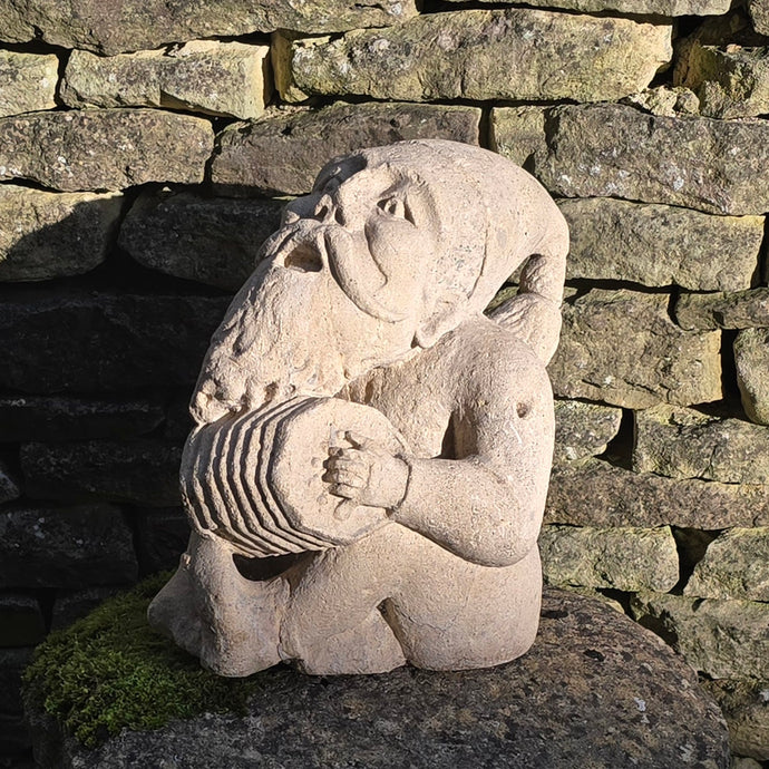 Wonderfully-detailed-carved-limestone-musician-gnome-large-scale-detailed-carving-bearded-gnome-seated-position-head-back-full-song-singing-playing-squeeze-box-concertina-inside-outside-mythical-protector-natural-environment-garden-folklore dating back-english-circa-1900-ornament-for-sale-damon-blandford-antiques-stow-on-the-wold-cotswolds