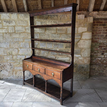 Load image into Gallery viewer, good-colour-georgian-welsh-oak-dresser-with-rack-constructed-from-well-figured-timbers-dresser-comprises-three-drawers-above-cupids-bow-shap- frieze-turned-supports-pot-board-excellent-condition-fresh-to-market-attractive-useful-furniture-south-wales-circa-1790-1810-good-original-condition-for-sale-damon-blandford-antiques-stow-on-the-wold
