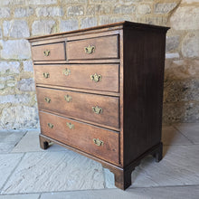 Load image into Gallery viewer, good-late-18th-century-oak-chest-of-drawers-constructed-from-well-figured-timbers-two-short-three-long-graduated-drawers-ovolo-moulding-original-brass-drop-handles-bracket-feet-good-colour-excellent-restored-condition-for-sale-damon-blandford-antiques-stroud-cotswolds-antique-furniture-storage
