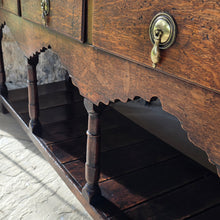 Load image into Gallery viewer, good-colour-georgian-welsh-oak-dresser-with-rack-constructed-from-well-figured-timbers-dresser-comprises-three-drawers-above-cupids-bow-shap- frieze-turned-supports-pot-board-excellent-condition-fresh-to-market-attractive-useful-furniture-south-wales-circa-1790-1810-good-original-condition-for-sale-damon-blandford-antiques-stow-on-the-wold
