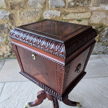 Load image into Gallery viewer, Good-quality-early-19th-century-Irish-cellarette-sarcophagus-form-pedestal-base-carved-acanthus-leaves-gadrooned-rope-twist-mouldings-brass-lion-mask-ring-carry-handles-oval-escutcheon-plate-original-lock-key-quadra-form-base-reeded-sabre-legs-hipped-carved-foliate-decoration-terminating-brass-box-toe-castors-furniture-excellent-colour-condition-patena-for-sale-damon-blandford-antiques-stow-on-the-wold-stroud-cotswolds-antique-drinks-bottles-storage

