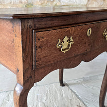 Load image into Gallery viewer, wonderful-shape-early-Georgian-oak-low-boy-top-with-moulded-edge-full-width-drawer-overlapping-ovolo-moulding-shaped-frieze-slim-tapered-cabriole-legs-elegant-useful-side-lamp-table-good-condition-provenance-vernacular-early-oak-country-for-sale-damon-blandford-antiques-stow-on-the-wold-gloucestershire
