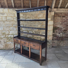 Load image into Gallery viewer, excellent-colour-georgian-oak-dresser-with-open-rack-three-shelves-moulded-cornice-hand-forged-iron-hooks-drawers-lined-in-pine-drawer-fronts-moulded-edges-brass-swan-neck-drop-handles-raised-on-primitive-supports-pot-board-excellent-condition-fresh-to-market-circa-1780-1800-for-sale-damon-blandford-antiques-stow-on-the-wold-kitchen-dinning-room-furniture
