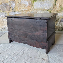 Load image into Gallery viewer, -coffer-bach-welsh-country-furniture-featuring-carved-dragon-highly-decorative-18th-century-welsh-oak-coffer-bach-lid-drawer-fronts-with-moulded-ovolo-edge-storage-space-oak-lined-drawers-overlapping-ovolo-moulding-brass-drop-handles-plinth-base-excellent-condition-for-sale-damon-blandford-antiques-stow-on-the-wold-cotswolds
