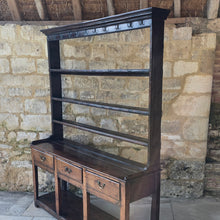 Load image into Gallery viewer, excellent-colour-georgian-oak-dresser-with-open-rack-three-shelves-moulded-cornice-hand-forged-iron-hooks-drawers-lined-in-pine-drawer-fronts-moulded-edges-brass-swan-neck-drop-handles-raised-on-primitive-supports-pot-board-excellent-condition-fresh-to-market-circa-1780-1800-for-sale-damon-blandford-antiques-stow-on-the-wold-kitchen-dinning-room-furniture
