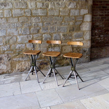 Load image into Gallery viewer, Three early Evertaut industrial stools with elm seats and back rests
