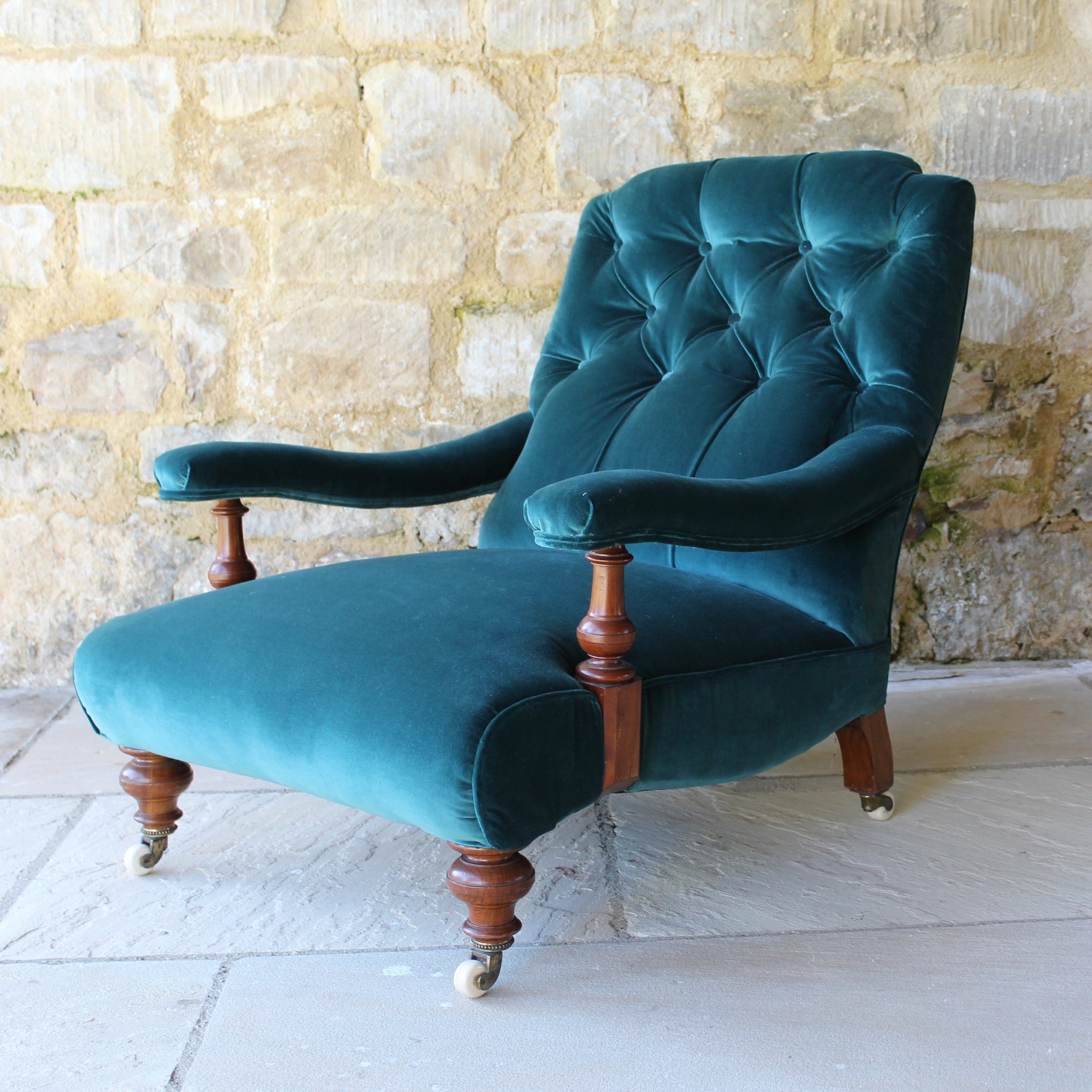 Low deep seated Victorian open armchair in the style of James Shoolbre Damon Blandford Antiques