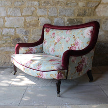 Load image into Gallery viewer, two-small-seater-upholstered-sofa-settee-turned-rosewood-legs-square-swept-concave-brass-cators-stamped-holland-&amp;-sons-damon-blandford-antiques-chair-seating-for-sale-gloucestershire-chintz-floral-velvet-burgundy-roses-quality-fine-london-maker
