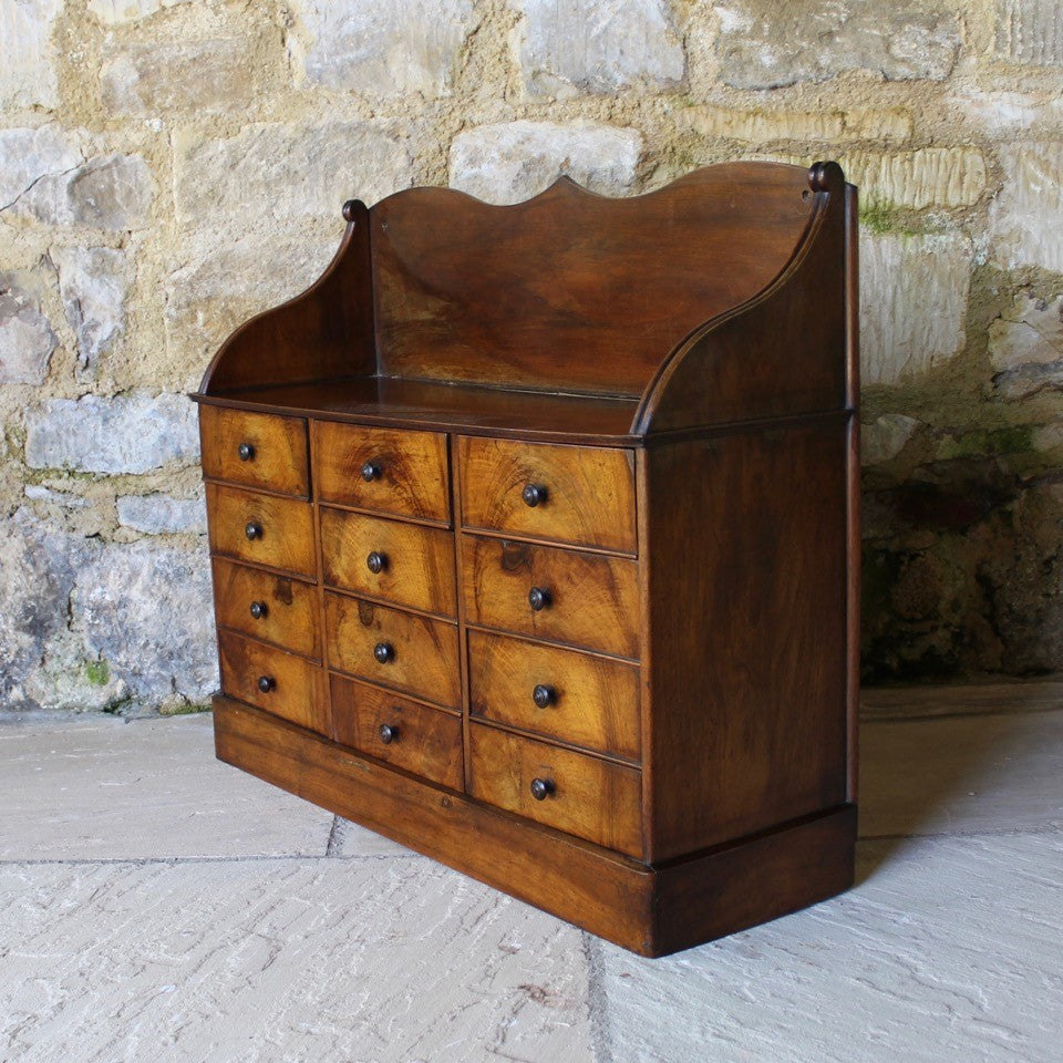 Rare bank of twelve French shop drawers in pollard oak