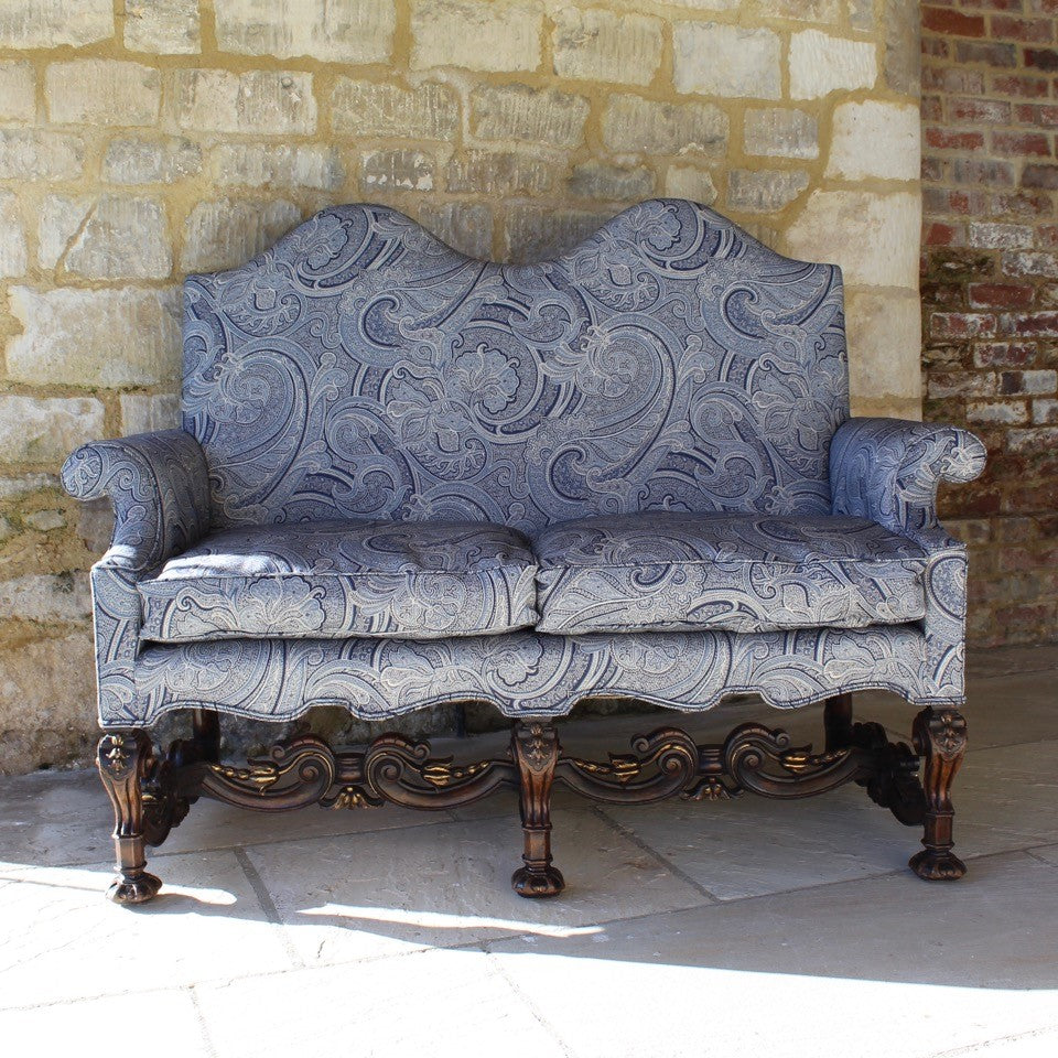 jacobean-revival-settee-exceptionally-good-quality-newly-upholstered-stunning-ludhiana-wool-fabric-intricate-decoration-inspiration-traditional-indian-patterns-features-swirling-floral-design-blue-cream-colourway-seat-completely-re-built-original-horse-hair-seat-pad-feather-cushions-settee-incredibly-stylish-comfortable-carved-parcel-gilt-show-wood-legs-stretchers-foliate-design-statement-piece-english-circa-1900-damon-blandford-antiques-stroud-gloucestershire-interior-design-seating-for-sale