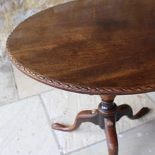 Load image into Gallery viewer, very-nice-george-III-third-mahogany-tilt-top-tripod-table-top-single-plank-mahogany-really-attractive-rim-carved-harlequin-design-repeated-tripod-legs-top-ring-turned-baluster-shape-pedestal-table-wonderful-patina-gold-red-colours-contrasting-darker-brown-black-appearance-created-really-good-decorative-highly-functional-tilt-top-table-damon-blandford-antiques-cotswolds-gloucestershire-stroud-for-sale-interior-design
